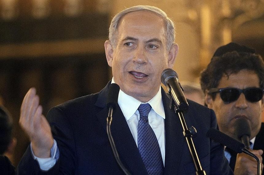 Israel's Prime Minister Benjamin Netanyahu gives a speech during a ceremony for the victims of the attacks in Paris this week, which claimed 17 lives, at the Grand Synagogue in Paris, France, on 11 Jan 2015. -- PHOTO: EPA