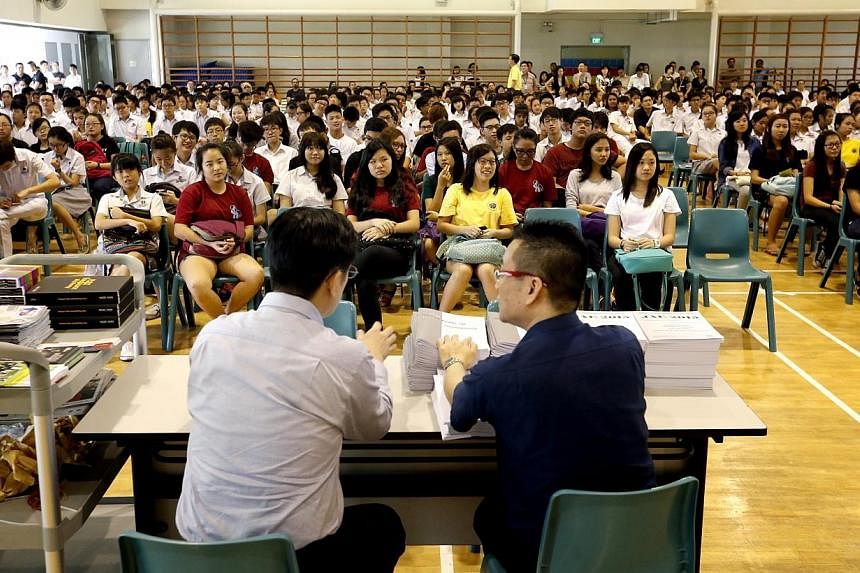 The first batch of Edgefield Secondary School students awaiting their GCE O-level examination results in the school hall on Jan 12, 2015. -- ST PHOTO: CHEW SENG KIM&nbsp;
