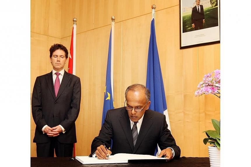 Foreign Affairs and Law Minister K Shanmugam signing a condolence book for victims of the Paris terror attacks at the French Embassy on Cluny Road.&nbsp;The "barbaric" terrorist attacks in Paris last week were the acts of "sick and mad people" and ha