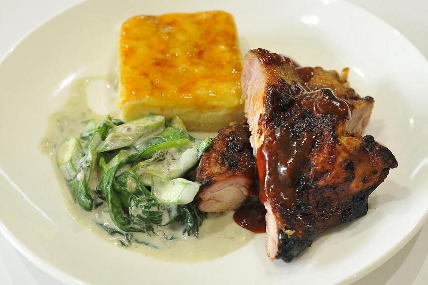 The jerk chicken (above) by Lime House’s chef Hasan Defour is marinated overnight so that it is flavourful. -- PHOTO: DIOS VINCOY JR FOR THE STRAITS TIMES