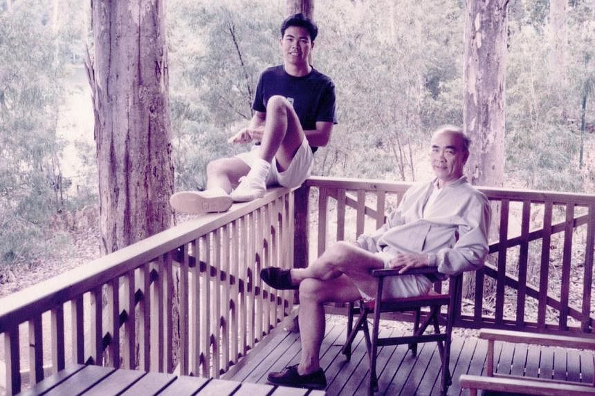 Mr Ng, aged 25, with his father, Mr Ng Chue Seng, at his brother’s home in Perth. -- PHOTO: COURTESY OF TOM NG