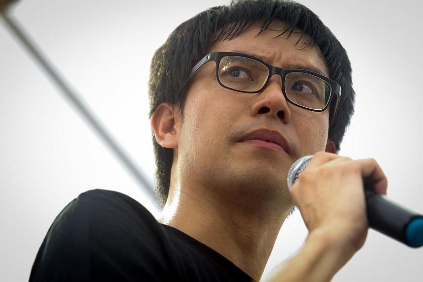 Blogger Roy Ngerng at the "Return Our CPF!" protest in Hong Lim Park on June 7, 2014.&nbsp;He has been ordered by the High Court to pay Prime Minister Lee Hsien Loong $29,000 in costs for the defamation suit. -- PHOTO: ST FILE