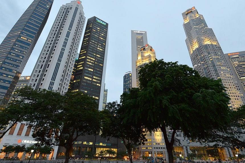 Singapore's CBD skyline. Amid mounting concerns of stronger global political headwinds and softer regional demand hitting exports, an index measuring confidence among Singapore businesses has tumbled at the start of the new year. -- ST PHOTO: LIM YAO