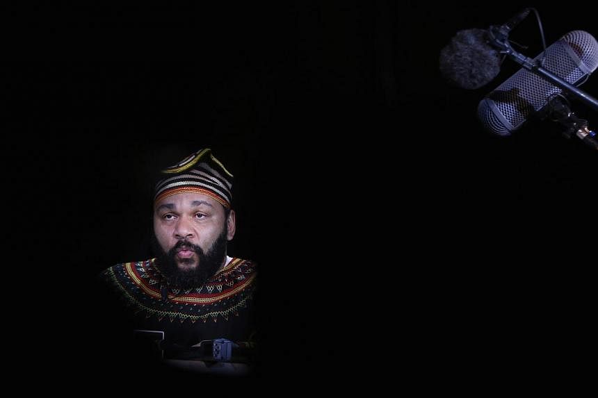 French comedian Dieudonne M'Bala M'Bala, also known as just "Dieudonne", attends a news conference at the Theatre de la Main d'or in Paris, in this photo taken in January last year. &nbsp;2014 file photo. -- PHOTO:&nbsp;REUTERS