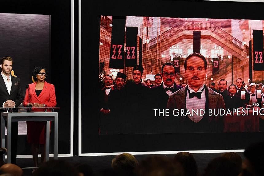 Hosts Chris Pine and Academy president Cheryl Boone announcing the movie 'The Grand Budapest Hotel' as one of the Oscar nominees for Best Picture. -- PHOTO: AFP