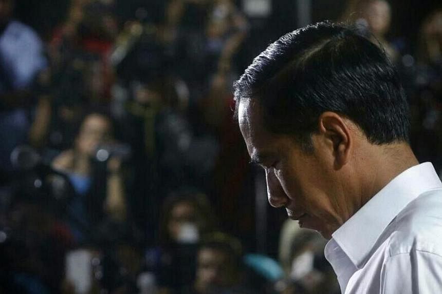 Indonesia's new president, Joko Widodo, is facing mounting pressure to replace his sole pick for national police chief after the anti-graft agency declared the nominee a corruption suspect. -- ST PHOTO: KEVIN LIM
