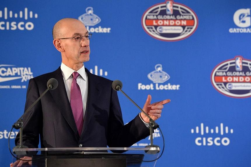 NBA Commisioner Adam Silver gestures during a press conference ahead of the 2015 NBA global game between Milwaukee Bucks and New York Knicks at the O2 Arena in London on Jan 15, 2015. -- PHOTO: AFP