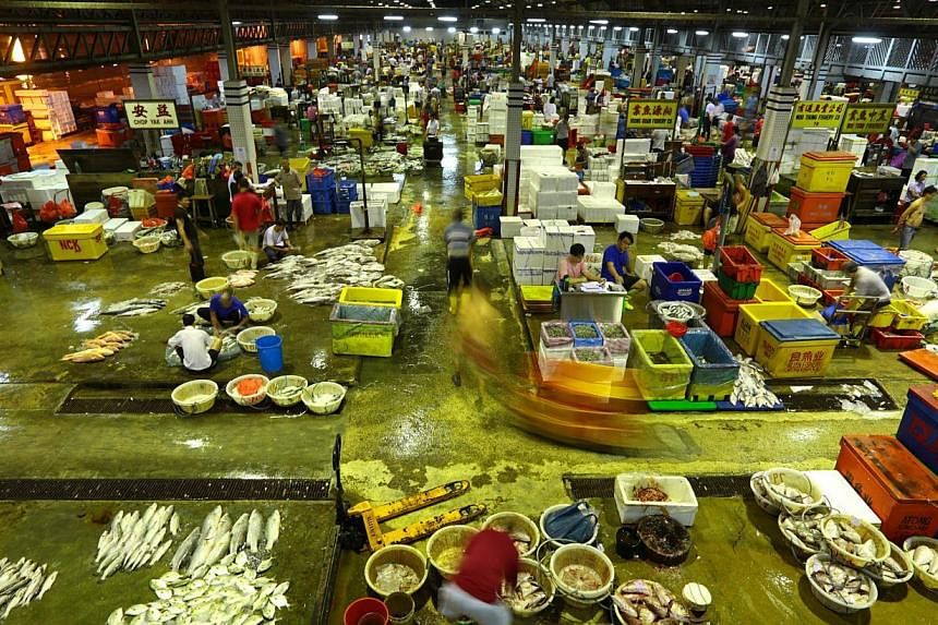 The wholesale fish market at the Jurong Fishery Port, where 250 tonnes of seafood is sold every day. -- PHOTO: THE NEW PAPER
