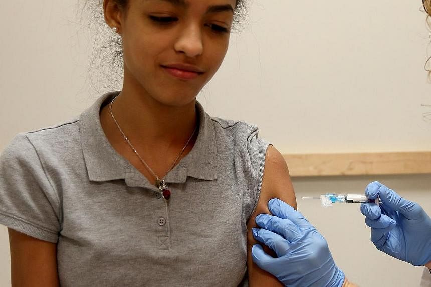 This US winter season's flu vaccine has been just 23 per cent effective at preventing doctor visits for people of all ages, according to health authorities' early estimates out Thursday. -- PHOTO: AFP
