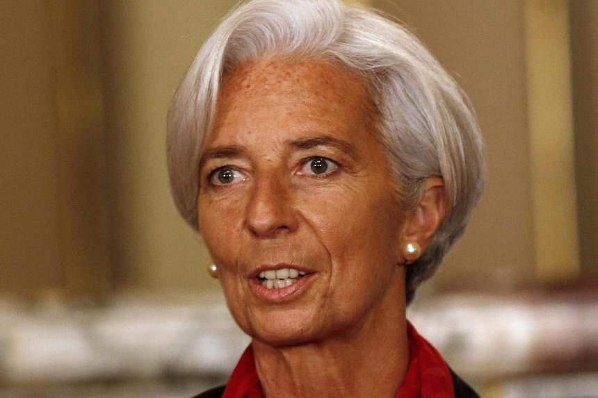 IMF chief Christine Lagarde (above) on Thursday encouraged the European Central Bank to unleash fresh stimulus on the ailing euro zone, saying falling global oil prices increase the risk of deflation.&nbsp;-- PHOTO: REUTERS
