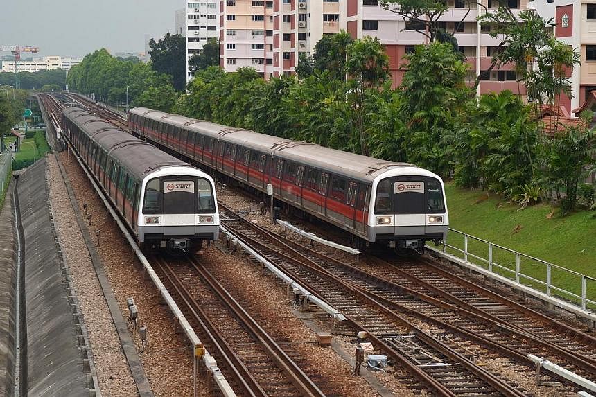 MRT trains travelling on tracks. The Land Transport Authority (LTA) is taking steps to make it harder for intruders to gain access to train tracks via anti-climb barriers topped with razor blades. -- ST PHOTO: ALPHONSUS CHERN&nbsp;