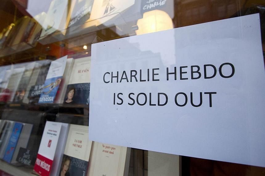 A sign that reads "Charlie Hebdo Is Sold Out" is seen in the window of a French book shop, earlier selling the satirical magazine Charlie Hebdo, in London on Jan 16, 2015. The chief editor of Charlie Hebdo has defended the satirical magazine's contro