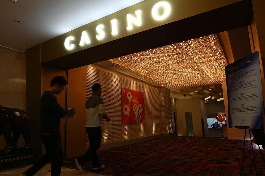 Chinese tourists enter Paradise Casino inside the Jeju Grand Hotel in Jeju, South Korea, on March 16, 2014.&nbsp;South Korea said on Sunday, Jan 18, 2015, that it will approve two more casino resorts and the building of around 5,000 new hotel rooms t