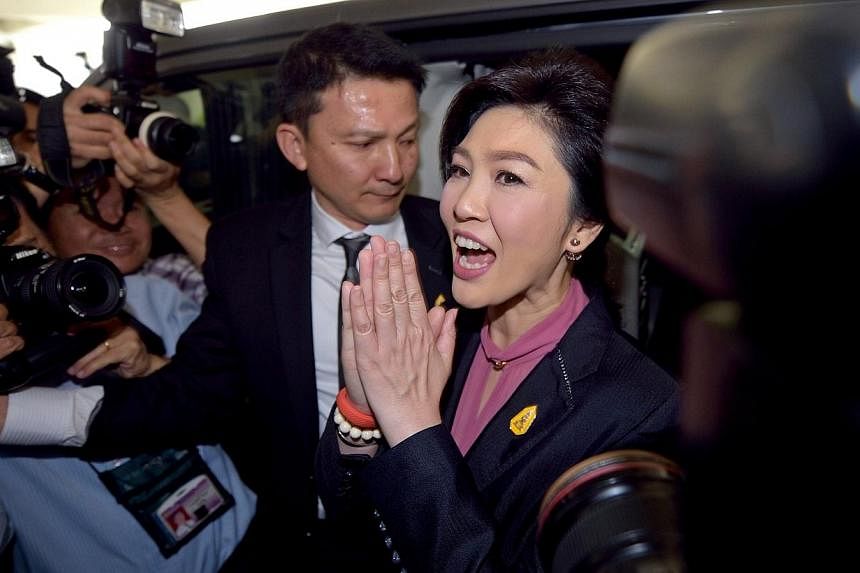 Four senior members of the former government of ousted prime minister Yingluck Shinawatra have defended her on social media over a controversial rice buying scheme after she failed to appear at her second impeachment hearing on Friday, Jan 16, 2015. 