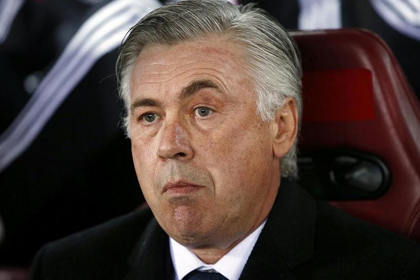 Real Madrid coach Carlo Ancelotti (above) has dismissed suggestions that the world and European champions' recent stumble is a result of the physical toll a packed calendar may have taken on his players. -- PHOTO: REUTERS