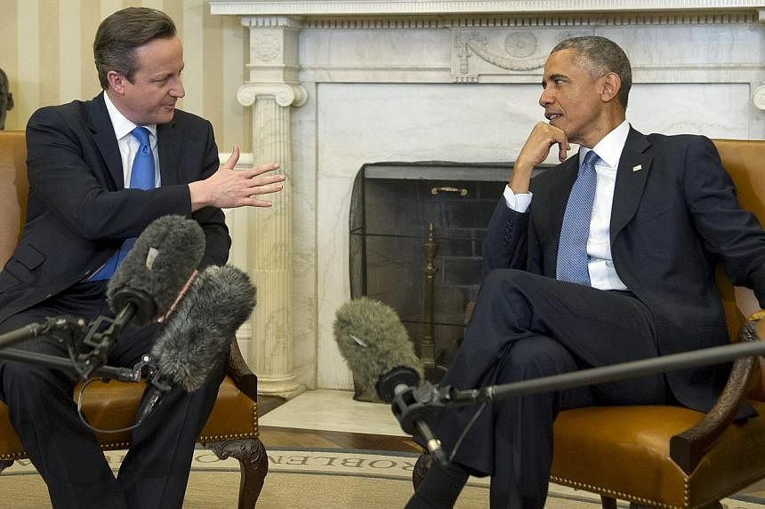 United States President Barack Obama (right) meets Prime Minister David Cameron (left) of the United Kingdom in the Oval Office of the White House in Washington, DC, USA on 16 Jan 2015. British Foreign Secretary Philip Hammond and United States Secre