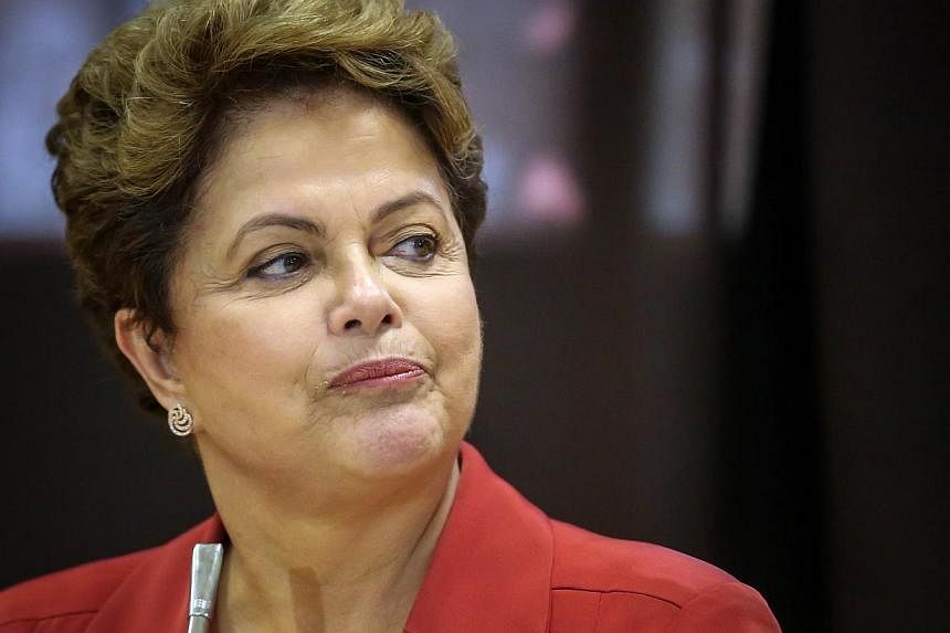 Brazilian President Dilma Rousseff&nbsp;(above) was "distressed and outraged" after Indonesia defied her repeated pleas and executed one of her countrymen convicted of drug trafficking, a spokesman said Saturday. -- PHOTO: AFP