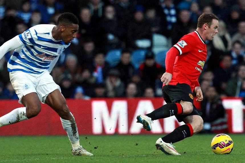 QPR's Leroy Fer and Wayne Rooney of Manchester United during their teams' Premier League game on Jan 17, 2015. Marouane Fellaini and James Wilson came off the substitutes' bench to earn Manchester United a 2-0 victory at struggling Queens Park Ranger