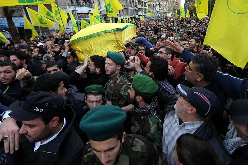 Lebanese Hezbollah supporters carry the coffin of militant Jihad Mughniyeh during his funeral in a southern Beirut suburb on Jan 19, 2015. The fundamental origins of Islamist extremism and militancy lie in the failure of Muslim states, and other stat