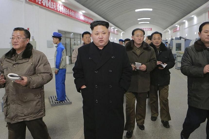 North Korean leader Kim Jong Un (centre) visits the Kangdong Precision Machine Plant in this undated photo released by North Korea's Korean Central News Agency (KCNA) in Pyongyang on Jan16, 2015. North Korea threatened to reconsider proposals for dia