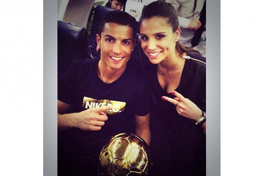 Lucia Villalon posted a picture of herself posing with Ronaldo and his Ballon d'Or trophy on her Twitter account. -- PHOTO: LUCIA VILLALON/TWITTER