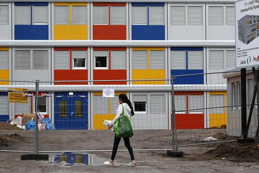 A resident enters a new refugee centre for housing asylum seekers in the Koepenick district of Berlin on Jan 2, 2015.&nbsp;Germany's population rose to 81.1 million people in 2014, the fourth annual increase in a row, boosted by the highest level of 