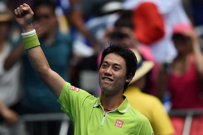 Kei Nishikori of Japan celebrating his victory over Ivan Dodig of Croatia in their men's singles match on day four of the Australian Open in Melbourne on Jan 22, 2015. -- PHOTO: AFP&nbsp;