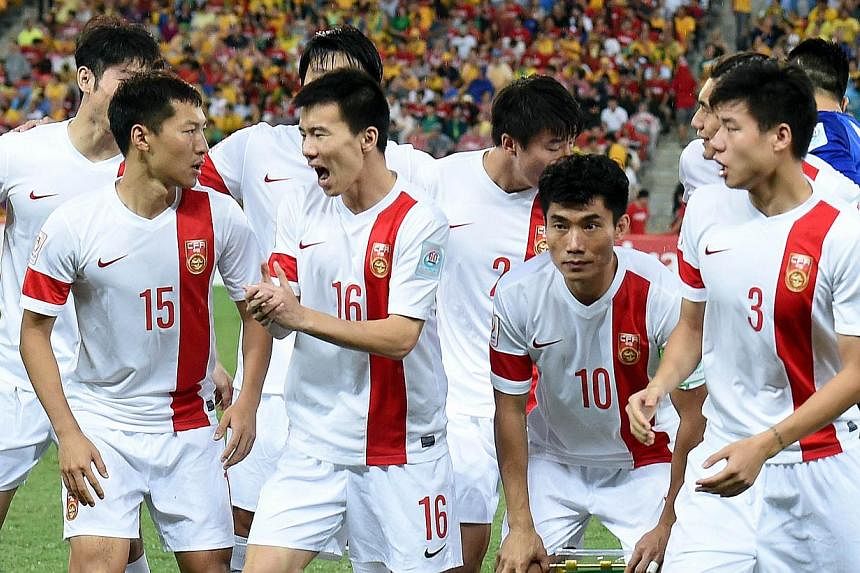 Chinese players get ready to face Australia in the quarter-final football match between Australia and China at the AFC Asian Cup in Brisbane on Jan 22, 2015.&nbsp;China coach Alain Perrin said he now knows the task facing his side as they face up to 