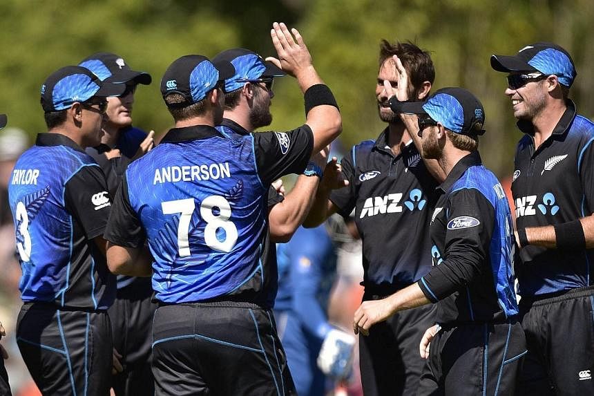 New Zealand celebrate Sri Lanka's Lahiru Thirimanne being caught out during the fifth one-day International cricket match between New Zealand and Sri Lanka in Dunedin at University Oval on Jan 23, 2015. -- PHOTO AFP