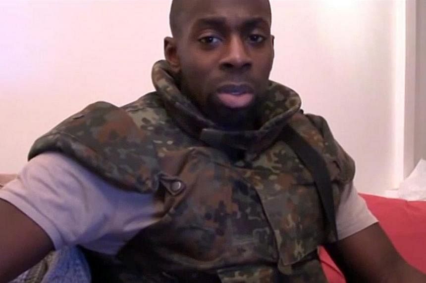 Amedy Coulibaly declaring his allegiance in an unknown location to the Islamic State in this still image taken from video on Jan 11, 2015. -- PHOTO: REUTERS &nbsp;