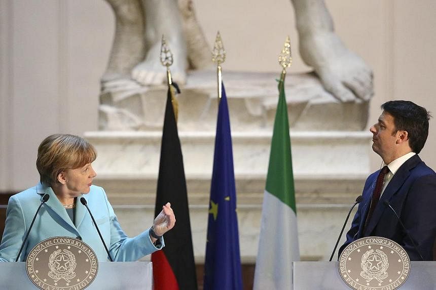 Germany's Chancellor Angela Merkel (left) talks during a joint news conference with Italy's Prime Minister Matteo Renzi at the end of a meeting at the Galleria dell'Accademia in Florence on Jan 23, 2015. -- PHOTO: REUTERS