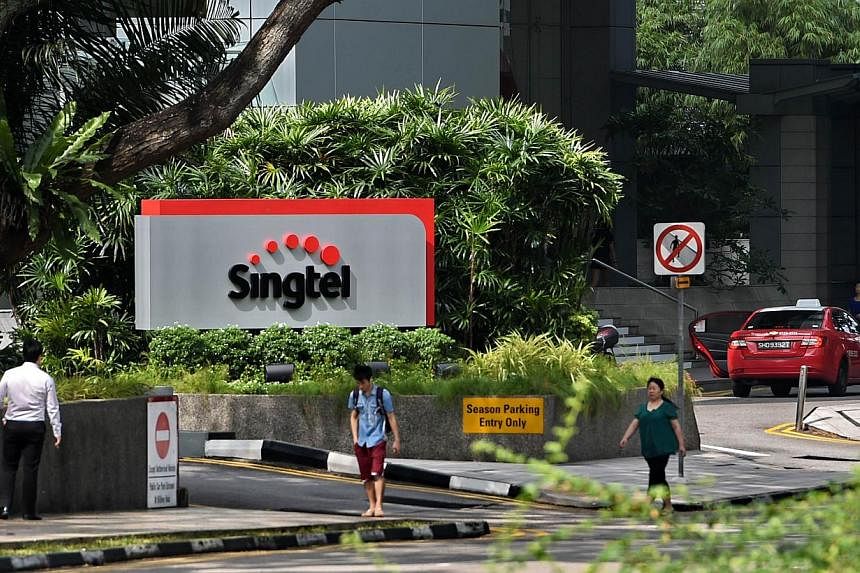 Singapore Telecom's (SingTel) new logo displayed on its building in Singapore. -- PHOTO: AFP