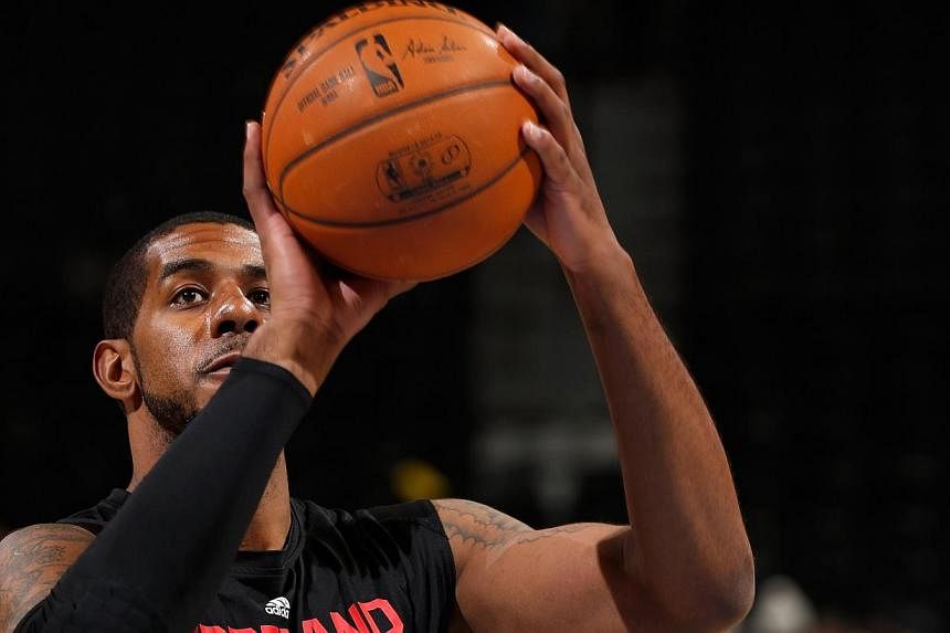 Portland Trail Blazers forward LaMarcus Aldridge could miss up to two months of the 2014-15 National Basketball Association season with a thumb injury, the team announced on Thursday. -- PHOTO: AFP&nbsp;