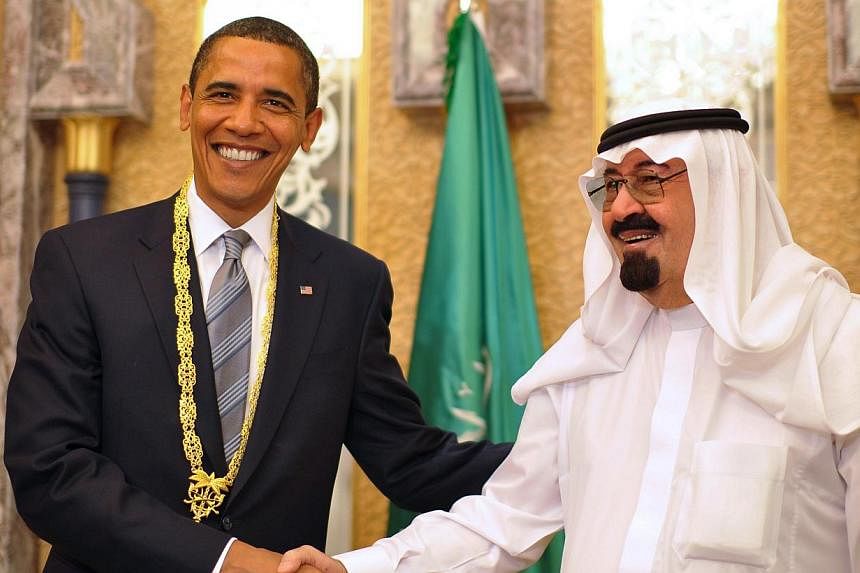 US President Barack Obama (left) shaking hands with Saudi King Abdullah on June 3, 2009. -- PHOTO: AFP