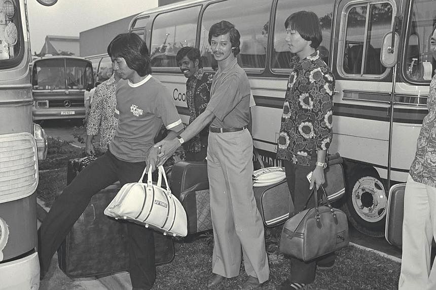 The Malaysian badminton team arriving in Singapore to compete in the Yonex invitation circuit in 1980. -- ST FILE PHOTO