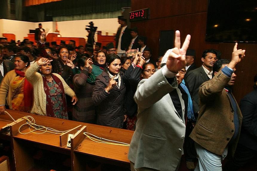 Constitution assembly members shout slogans before leaving the Constitution Assembly hall in Kathmandu, Nepal, Jan 22 2015. Nepal's lawmakers failed to agree on a new constitution Thursday as a midnight deadline expired, deepening public frustration 