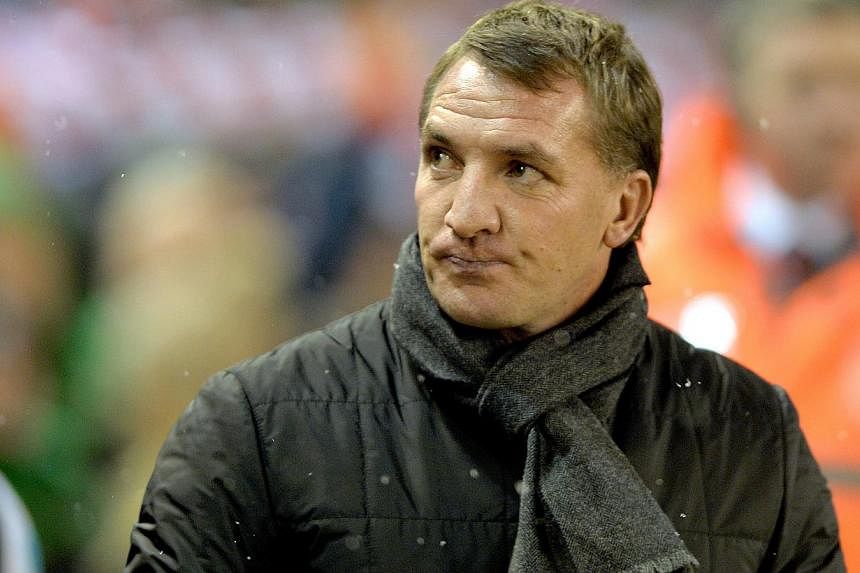 Liverpool will be back challenging for the Premier League title next season after slipping off the pace this time round, manager Brendan Rodgers (above) said on Thursday. -- PHOTO: EPA