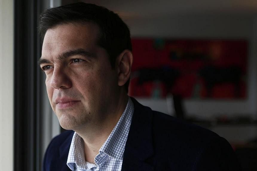 Greek leftist leader Alexis Tsipras on Friday said an absolute majority in Sunday's general election would "free" his hands to renegotiate the country's massive debt. -- PHOTO: REUTERS