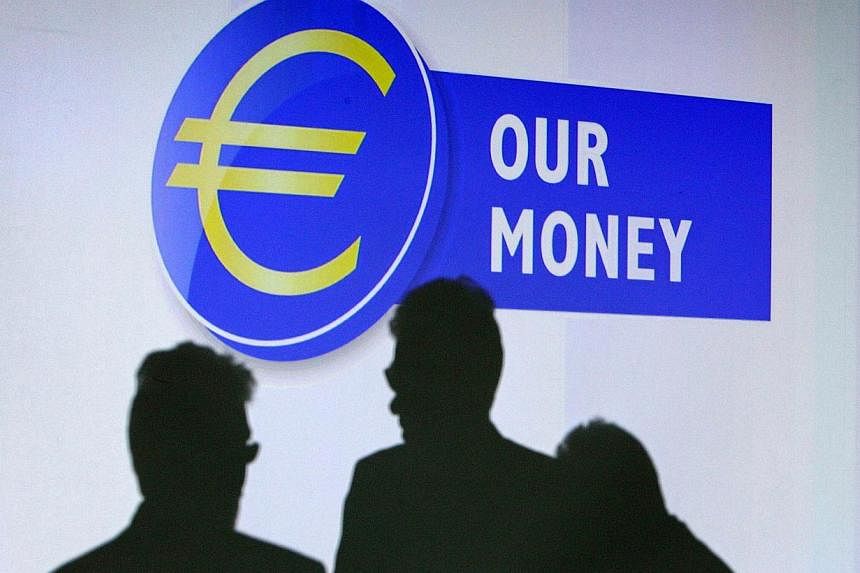 The euro fell again against the US dollar on Friday and the currency market is nervously awaiting the outcome of Greece's general election on Sunday. -- PHOTO: AFP