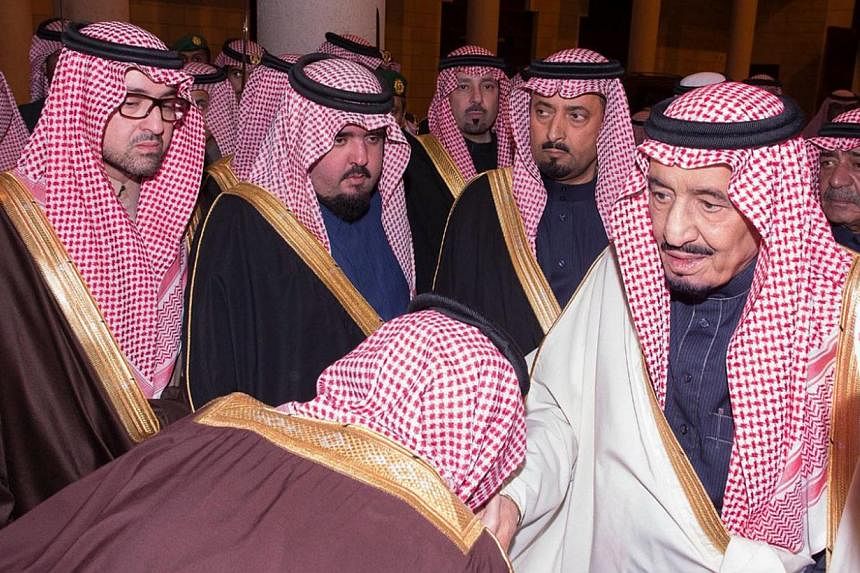 A handout photograph made available by the Saudi Press Agency (SPA) shows new Saudi King, Salman bin Abdul Aziz (right) receiving dignitaries, in Riyadh, Saudi Arabia on Jan 23, 2015. -- PHOTO: EPA