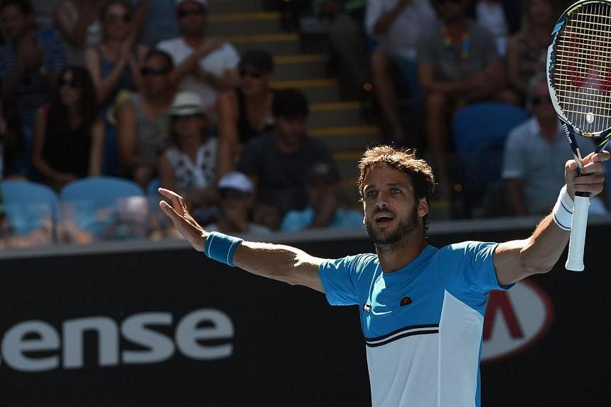 Feliciano Lopez of Spain celebrates his win over Jerzy Janowicz of Poland during the men's singles on day six of the 2015 Australian Open tennis tournament in Melbourne on Jan 24, 2015.&nbsp;Spaniard Feliciano Lopez showed a compassionate streak in a