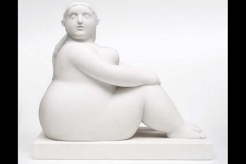 Works by Fernando Botero (with his painting The Square) on display include oil on canvas painting Couple On The Grass and marble sculpture Sitting Woman (above). -- PHOTO: INTERNATIONAL ART