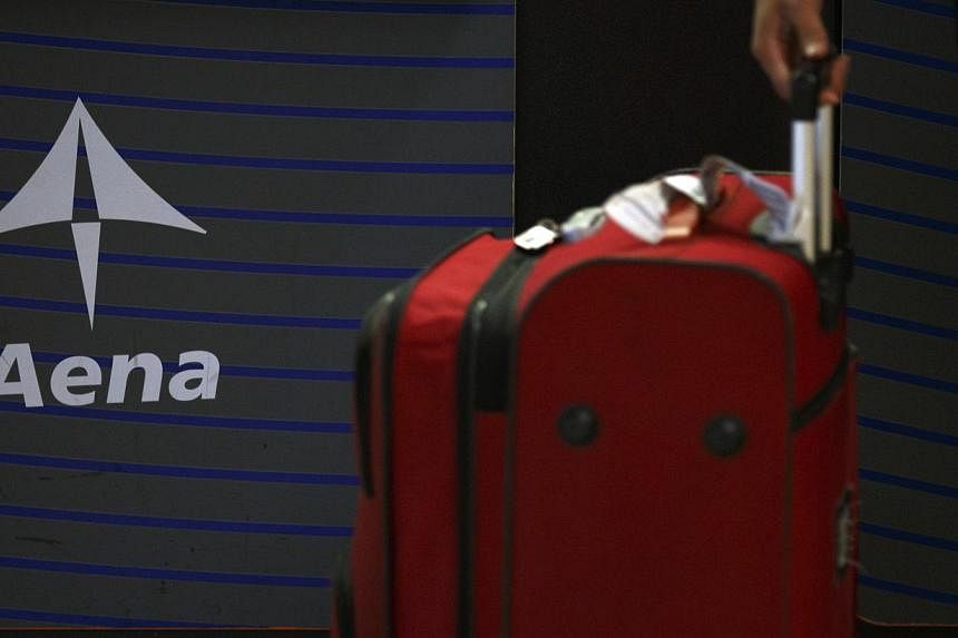 The Spanish government said Friday it would float a section of the world's largest airport operator Aena as part of a much-delayed privatisation of the firm, Europe's first major stock market listing of the year. -- PHOTO: REUTERS