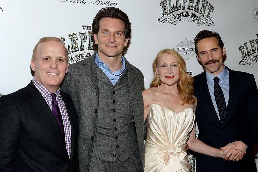 Director Scott Ellis (far left) with actors Bradley Cooper, Patricia Clarkson and Alessandro Nivola at a party following the opening night of The Elephant Man on Broadway. -- PHOTO: AFP&nbsp;