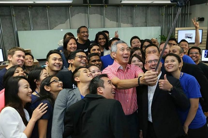 Mr Lee with staff of Facebook in Singapore. -- PHOTO: MCI/LEE HSIEN LOONG/FACEBOOK