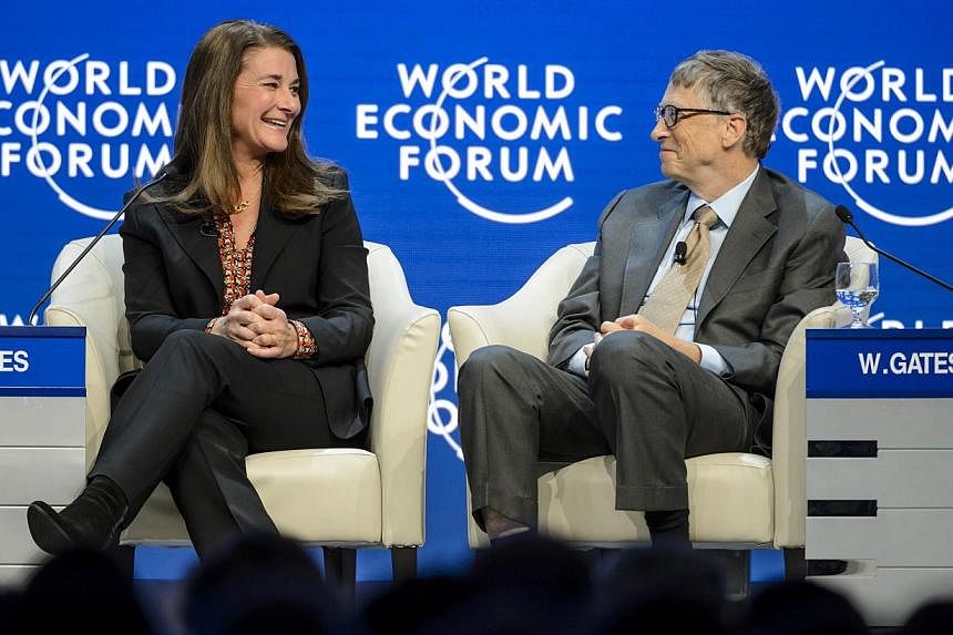 Melinda (left) and Bill Gates attend a session at the Congress Center during the World Economic Forum (WEF) annual meeting on Jan 23, 2015, in Davos. -- PHOTO: AFP