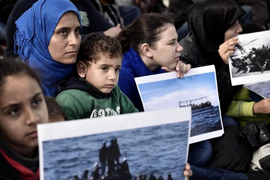 Syrian refugees living in Greece protest on Nov 19, 2014 in Athens, calling for immediate asylum status and housing.&nbsp;More than half of Europeans want less migration with up to 84 per cent of Greeks against any further rise, the International Org