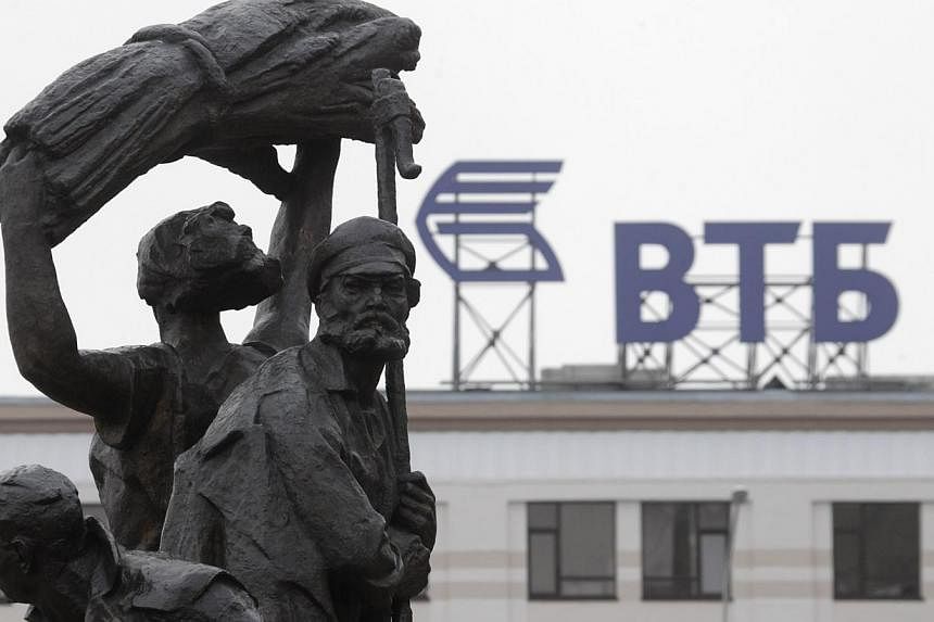 A fragment of a monument to Soviet state founder Vladimir Lenin is on display, with the advertising logo of VTB Bank seen in the background, in Stavropol, southern Russia, Jan 22, 2015.&nbsp;Russia may have to spend more than US$40 billion (S$53 bill
