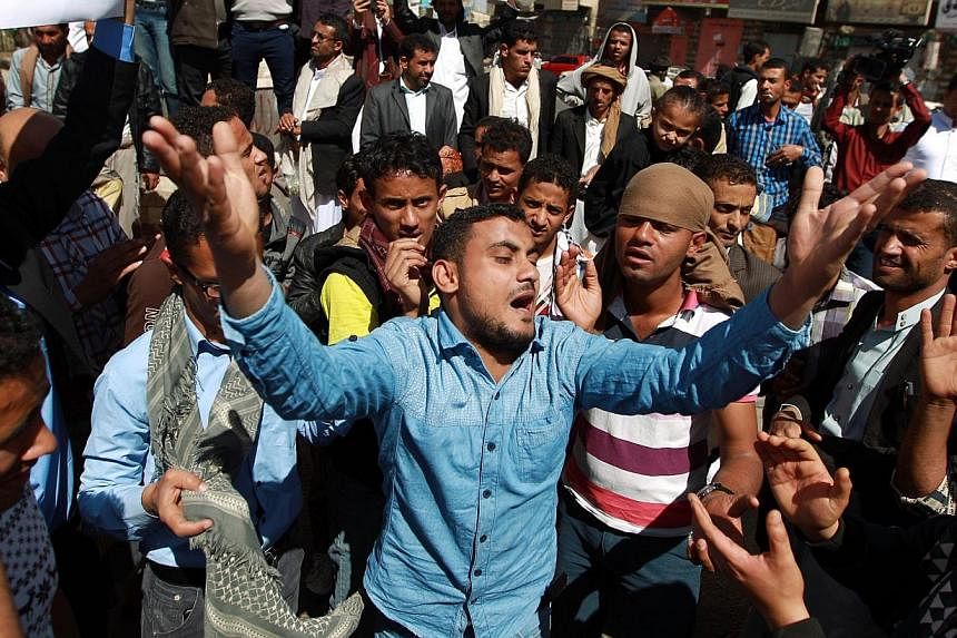 Yemeni protesters shout slogans during a rally against the control of the capital by Shi'ite Houthi rebels on Jan 23, 2015 in the capital Sanaa. -- PHOTO: AFP