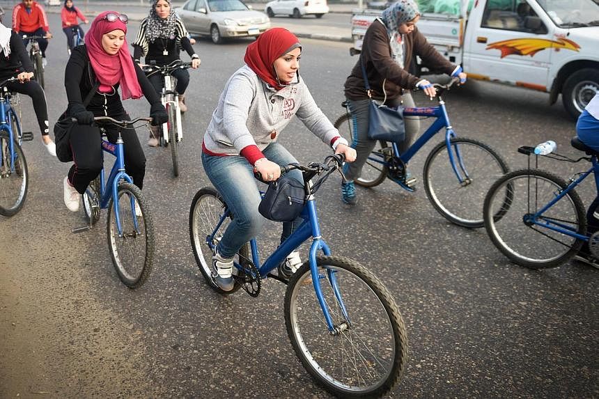 Egyptian members of the Go Bike group taking part in a bicycle ride in Cairo on Dec 27, 2014. -- PHOTO: AFP
